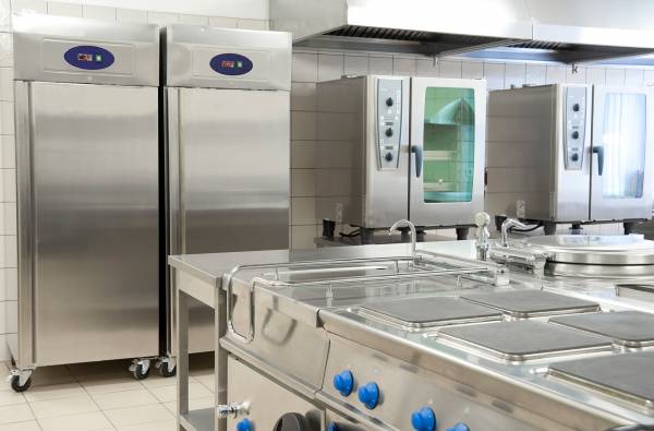 a commercial kitchen with side by side refrigeration equipment